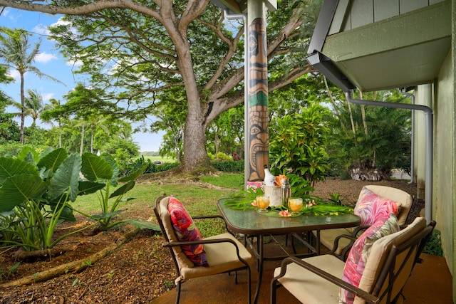 3880 Wyllie Rd Unit 21C, Princeville, HI 96722 - view of patio / terrace featuring outdoor dining area