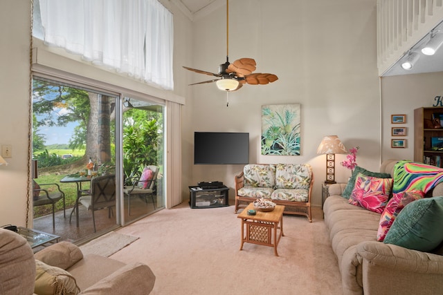 3880 Wyllie Rd Unit 21C, Princeville, HI 96722 - carpeted living room featuring a high ceiling and ceiling fan