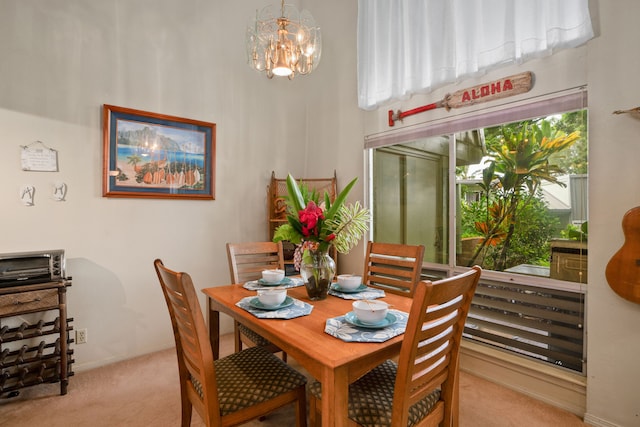 3880 Wyllie Rd Unit 21C, Princeville, HI 96722 - carpeted dining area featuring a chandelier