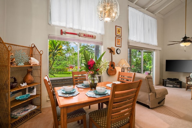 3880 Wyllie Rd Unit 21C, Princeville, HI 96722 - dining area with high vaulted ceiling, carpet, a chandelier, beamed ceiling, and ceiling fan