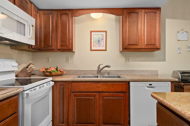3880 Wyllie Rd Unit 21C, Princeville, HI 96722 - kitchen featuring white appliances, light countertops, and brown cabinetry