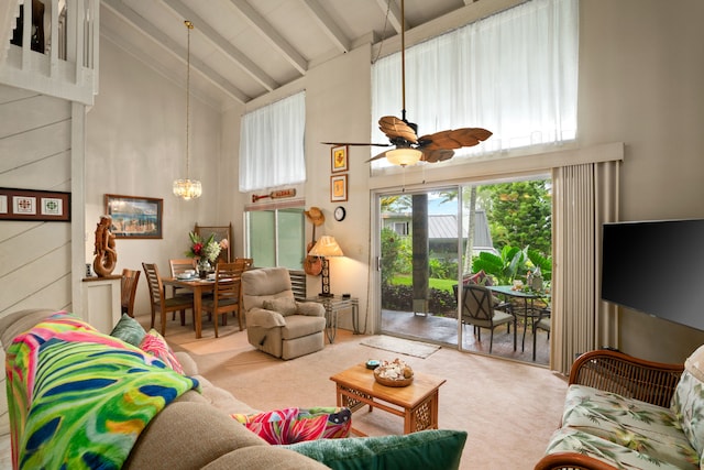 3880 Wyllie Rd Unit 21C, Princeville, HI 96722 - carpeted living room featuring high vaulted ceiling, beamed ceiling, a ceiling fan, and a chandelier