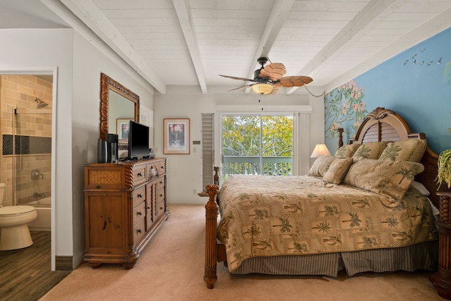 3880 Wyllie Rd Unit 21C, Princeville, HI 96722 - bedroom featuring beamed ceiling, ensuite bath, ceiling fan, and light colored carpet