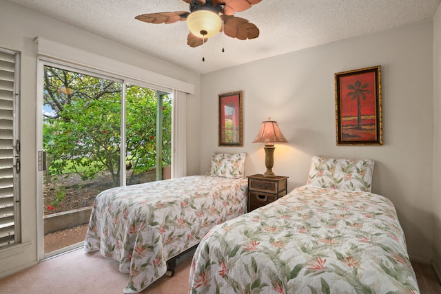 3880 Wyllie Rd Unit 21C, Princeville, HI 96722 - bedroom with access to outside, a textured ceiling, a ceiling fan, and carpet floors