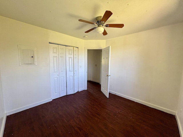 16-1814 34th Ave, Keaau, HI 96749 - unfurnished bedroom with electric panel, wood finished floors, baseboards, and a closet
