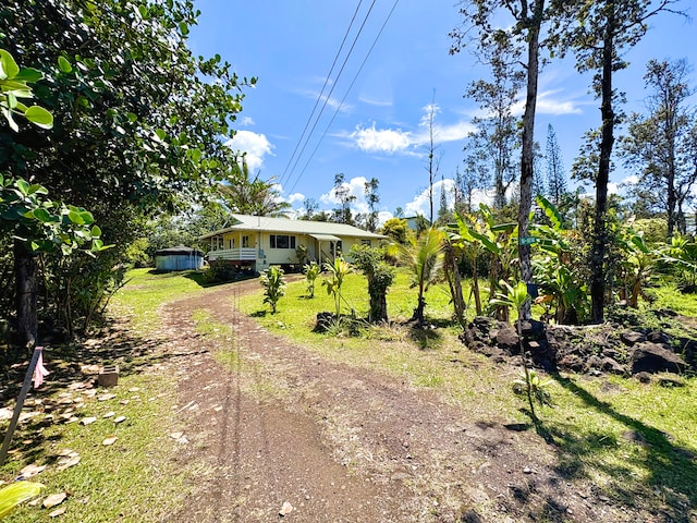 16-1814 34th Ave, Keaau, HI 96749 - view of grassy yard featuring dirt driveway