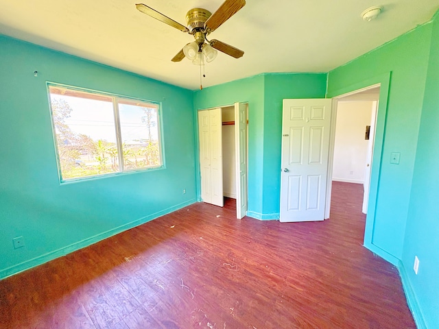 16-1814 34th Ave, Keaau, HI 96749 - unfurnished bedroom with wood finished floors, baseboards, a closet, and a ceiling fan