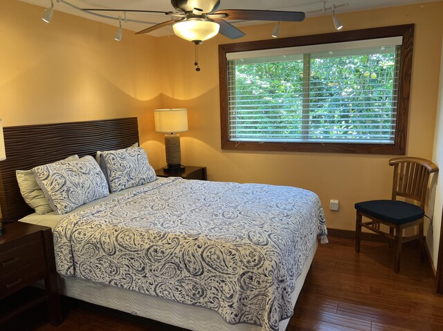 4892 Pepelani Lp, Princeville, HI 96722 - bedroom featuring track lighting, hardwood / wood-style floors, baseboards, and ceiling fan