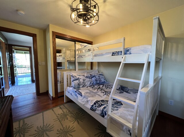 4892 Pepelani Lp, Princeville, HI 96722 - bedroom featuring a chandelier and baseboards
