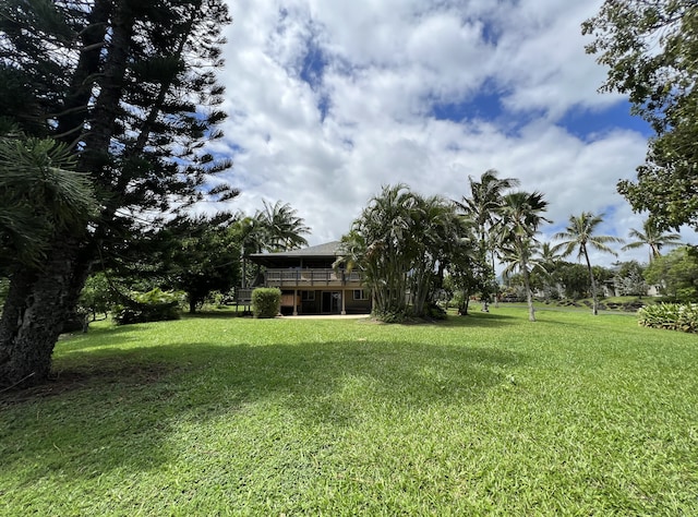 4892 Pepelani Lp, Princeville, HI 96722 - view of grassy yard featuring a wooden deck
