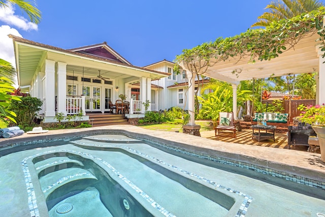 2758 Milo Hae Lp, Koloa, HI 96756 - swimming pool with french doors, a hot tub, outdoor lounge area, a ceiling fan, and a patio