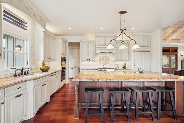2758 Milo Hae Lp, Koloa, HI 96756 - kitchen featuring stainless steel appliances, tasteful backsplash, light stone counters, a breakfast bar area, and recessed lighting