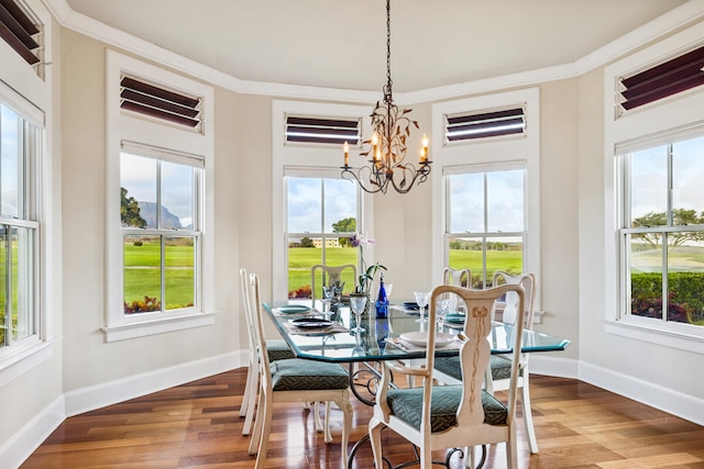 2758 Milo Hae Lp, Koloa, HI 96756 - dining area featuring a chandelier, wood finished floors, and crown molding