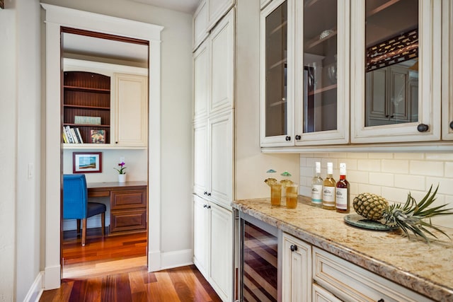 2758 Milo Hae Lp, Koloa, HI 96756 - indoor dry bar featuring beverage cooler, backsplash, wood finished floors, and built in desk
