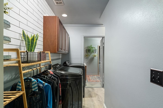 68-1846 Puu Nui St, Waikoloa, HI 96738 - laundry room with washing machine and clothes dryer, cabinet space, light wood-style floors, and recessed lighting