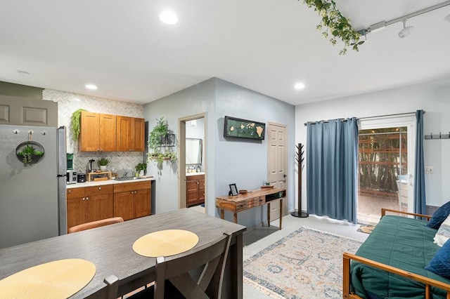 68-1846 Puu Nui St, Waikoloa, HI 96738 - kitchen with freestanding refrigerator, brown cabinetry, light countertops, decorative backsplash, and recessed lighting