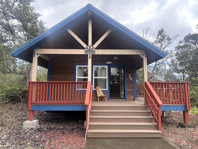 92-8618 Orchid Pkwy, Ocean View, HI 96737 - rear view of property featuring covered porch