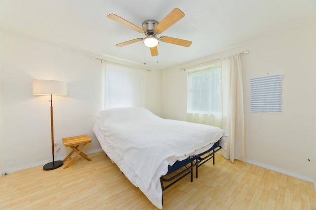92-8618 Orchid Pkwy, Ocean View, HI 96737 - bedroom with light wood-style floors and ceiling fan
