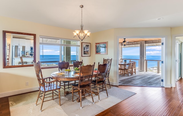 88-1965 Milolii Rd, Captain Cook, HI 96704 - dining area featuring a chandelier, wood finished floors, and a water view