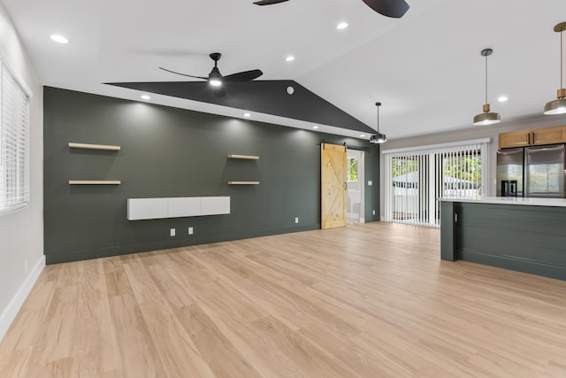15-1571 19th Ave, Keaau, HI 96749 - unfurnished living room with a ceiling fan, a barn door, lofted ceiling, and light wood-type flooring