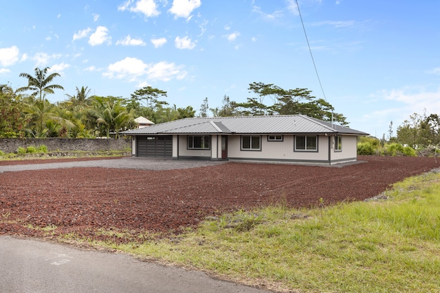 15-1571 19th Ave, Keaau, HI 96749 - ranch-style home with a garage, driveway, and a metal roof