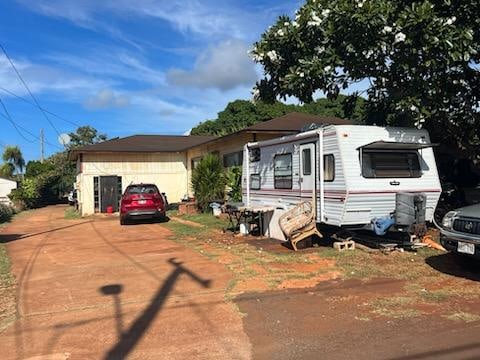 4873-A Alii Rd, Hanapepe, HI 96716 - view of front of property featuring driveway and a garage