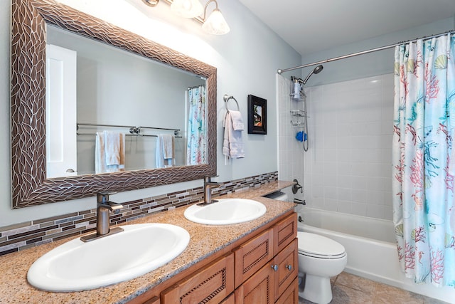 75-346 Hualalai Rd Unit B303, Kailua-Kona, HI 96740 - bathroom with double vanity, shower / bath combo with shower curtain, decorative backsplash, and tile patterned floors