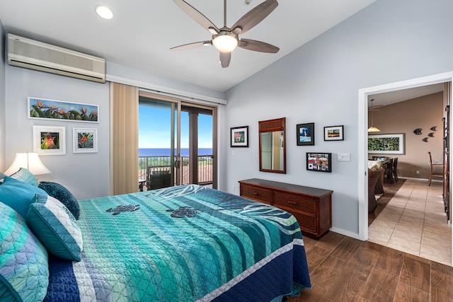 75-346 Hualalai Rd Unit B303, Kailua-Kona, HI 96740 - bedroom featuring a wall mounted air conditioner, access to outside, lofted ceiling, wood finished floors, and a ceiling fan