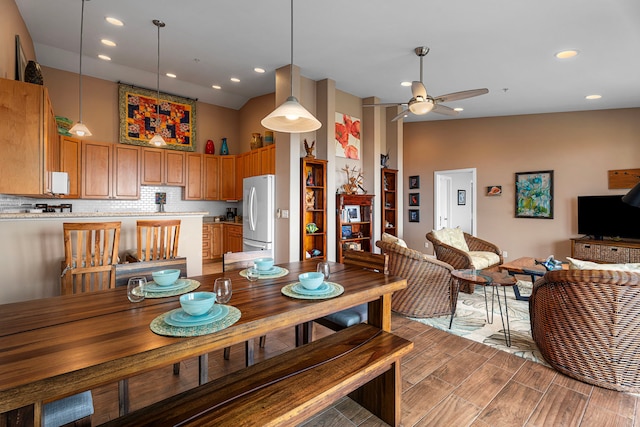 75-346 Hualalai Rd Unit B303, Kailua-Kona, HI 96740 - dining space with high vaulted ceiling, ceiling fan, recessed lighting, and light wood-style flooring