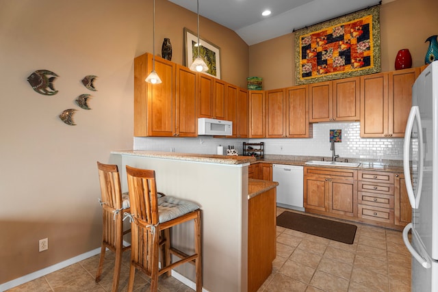 75-346 Hualalai Rd Unit B303, Kailua-Kona, HI 96740 - kitchen with white appliances, a high ceiling, a peninsula, light tile patterned floors, and tasteful backsplash