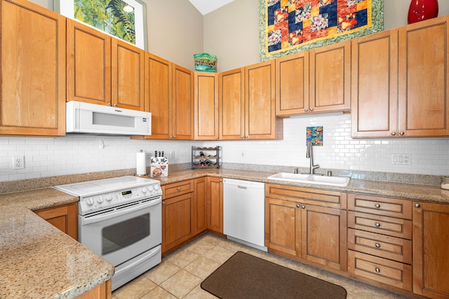 75-346 Hualalai Rd Unit B303, Kailua-Kona, HI 96740 - kitchen with white appliances, backsplash, brown cabinets, and light tile patterned flooring