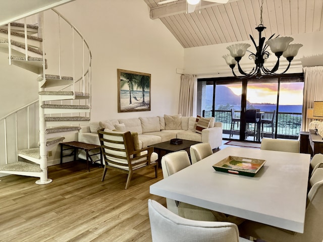 5380 Honoiki Rd Unit J33, Princeville, HI 96722 - dining area featuring stairs, light wood-style flooring, a wood ceiling with exposed beams, a chandelier, and high vaulted ceiling