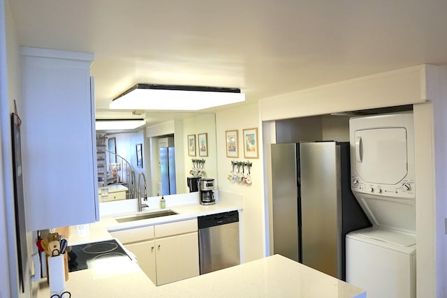 5380 Honoiki Rd Unit J33, Princeville, HI 96722 - kitchen with dishwasher, stacked washing machine and dryer, light countertops, and range with electric stovetop
