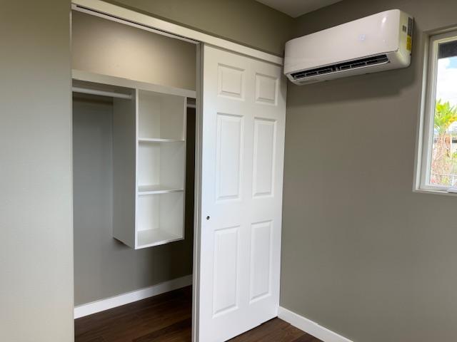 144 Chong St, Hilo, HI 96720 - closet featuring a wall mounted AC