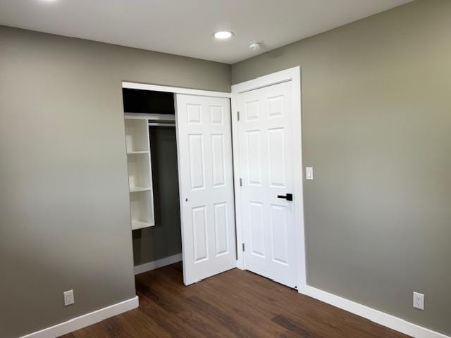 144 Chong St, Hilo, HI 96720 - unfurnished bedroom with dark wood-style floors, recessed lighting, and a closet