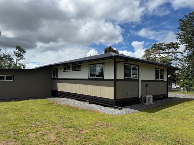 144 Chong St, Hilo, HI 96720 - view of home's exterior with a yard