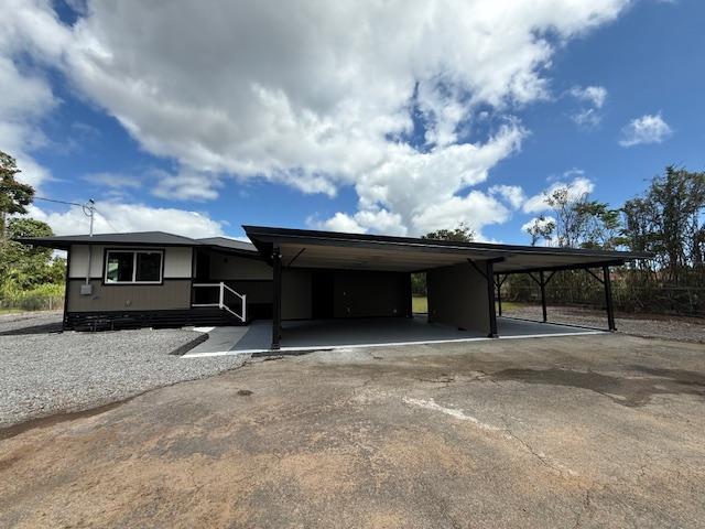 144 Chong St, Hilo, HI 96720 - view of front of house with an attached carport and driveway