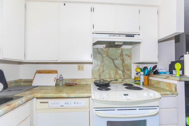 2916 Date St Unit 6F, Honolulu, HI 96816 - kitchen featuring white appliances, under cabinet range hood, light countertops, and white cabinets