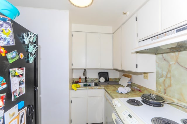 2916 Date St Unit 6F, Honolulu, HI 96816 - kitchen featuring under cabinet range hood, white electric range oven, light countertops, white cabinets, and freestanding refrigerator