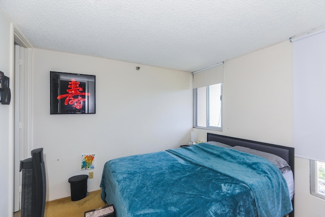 2916 Date St Unit 6F, Honolulu, HI 96816 - carpeted bedroom with a textured ceiling