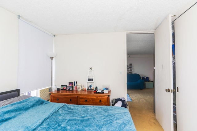 2916 Date St Unit 6F, Honolulu, HI 96816 - bedroom featuring light carpet and a textured ceiling