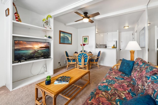 75-5870 Kahakai Rd Unit 308, Kailua-Kona, HI 96740 - living area featuring light carpet, ceiling fan, and beam ceiling