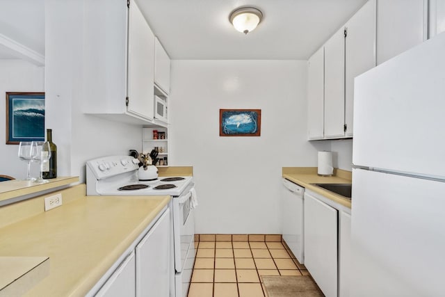 75-5870 Kahakai Rd Unit 308, Kailua-Kona, HI 96740 - kitchen with white appliances, light countertops, white cabinetry, and light tile patterned flooring