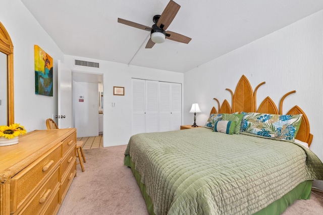 75-5870 Kahakai Rd Unit 308, Kailua-Kona, HI 96740 - bedroom featuring light carpet, a closet, ceiling fan, and light tile patterned flooring