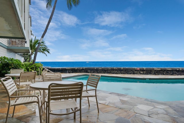 75-5870 Kahakai Rd Unit 308, Kailua-Kona, HI 96740 - outdoor pool featuring a water view and a patio