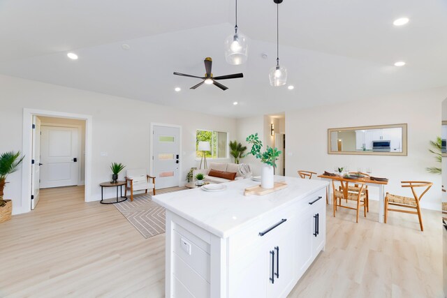 15-1955 Beach Rd, Keaau, HI 96749 - kitchen featuring vaulted ceiling, light wood-style floors, a kitchen island, white cabinetry, and recessed lighting