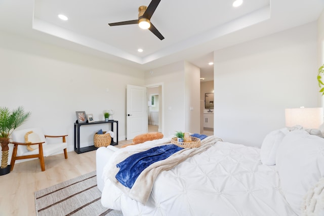 15-1955 Beach Rd, Keaau, HI 96749 - bedroom with light wood finished floors, a raised ceiling, recessed lighting, ensuite bath, and ceiling fan