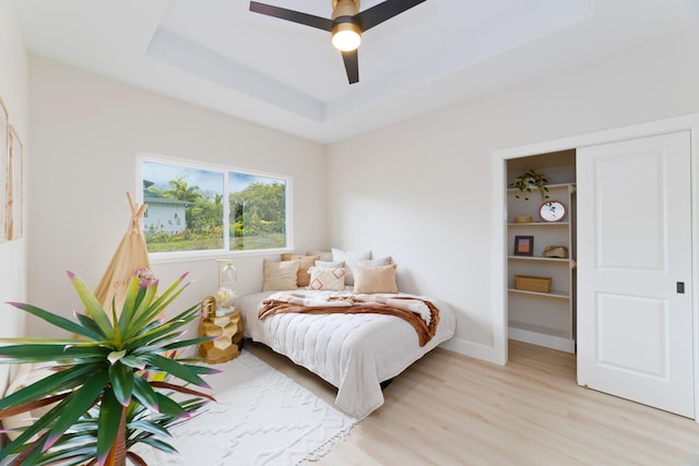 15-1955 Beach Rd, Keaau, HI 96749 - bedroom with light wood-style floors, a raised ceiling, and ceiling fan