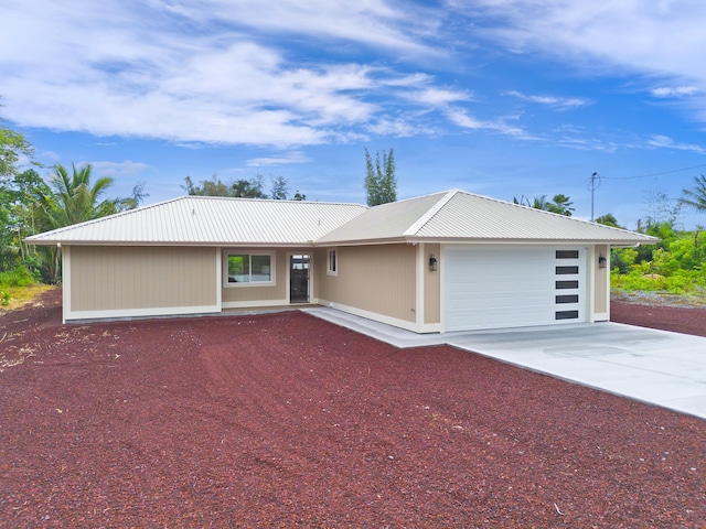 15-1955 Beach Rd, Keaau, HI 96749 - single story home featuring concrete driveway, a metal roof, and an attached garage