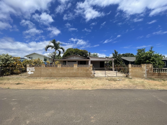 4548 Kawailoa St, Kekaha, HI 96752 - view of front of house featuring a fenced front yard and a gate